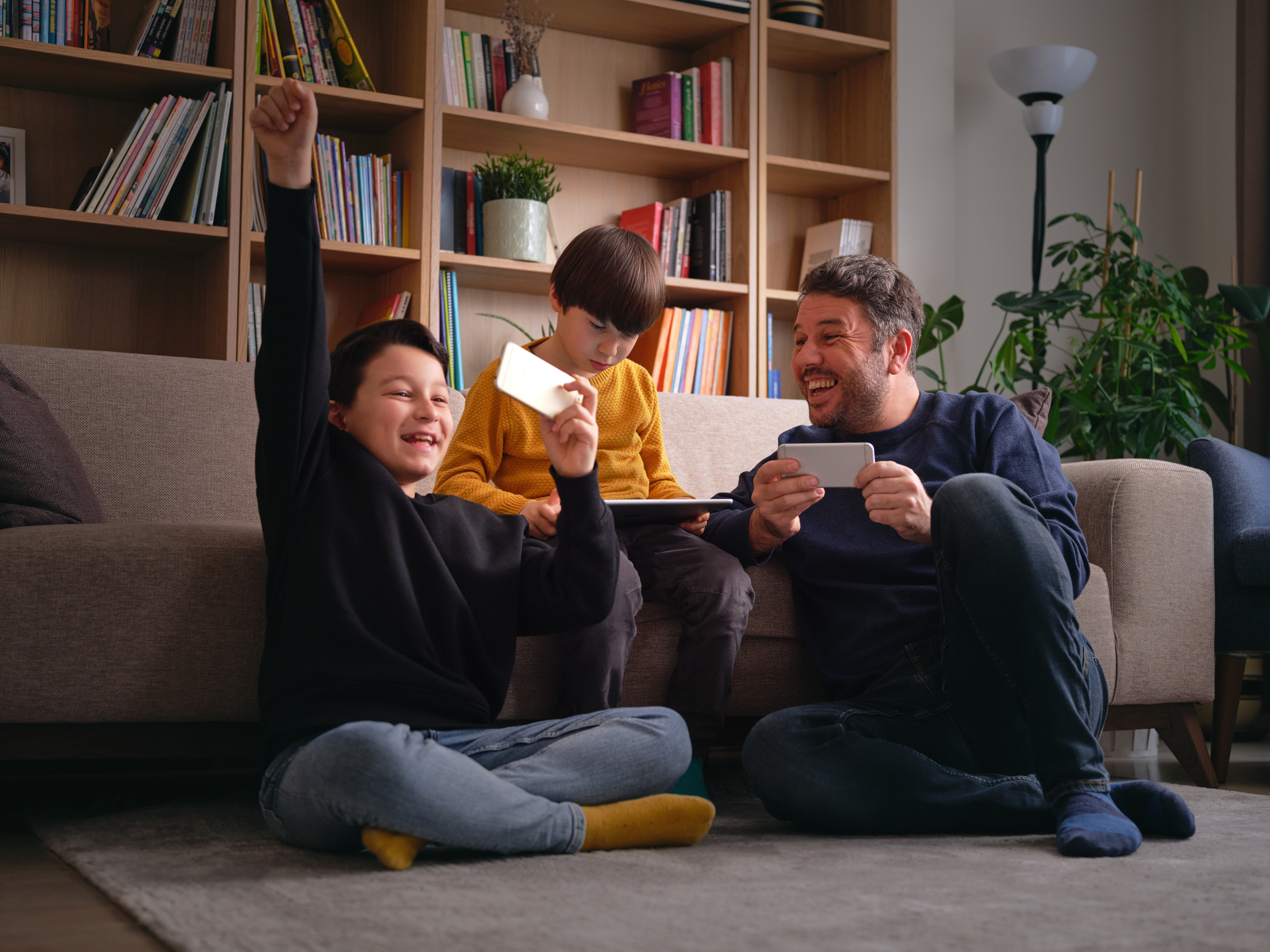 Family using devices at home